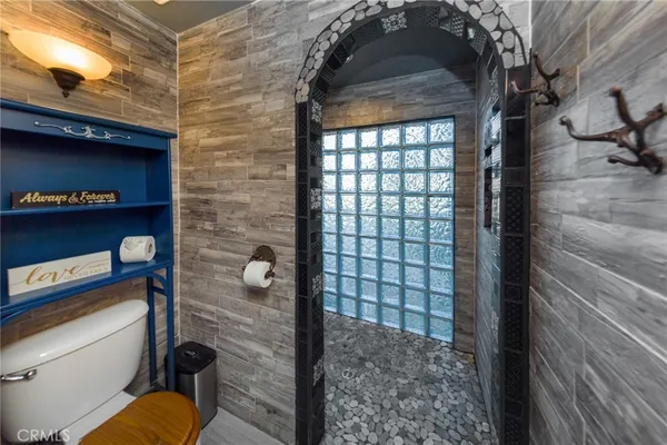 a bed room with a bed and a television