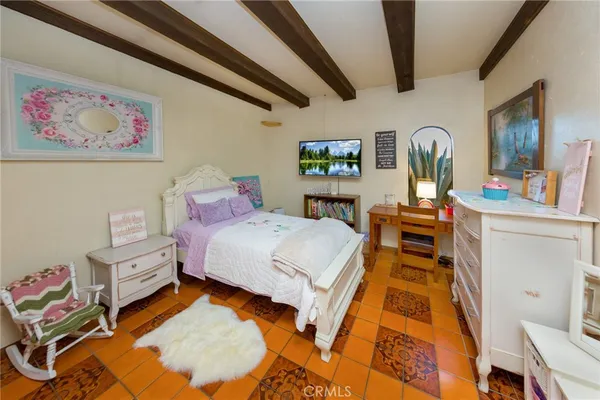 a view of a bedroom with washer and dryer