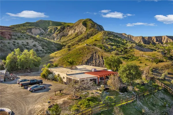 a view of multiple house with palm tree