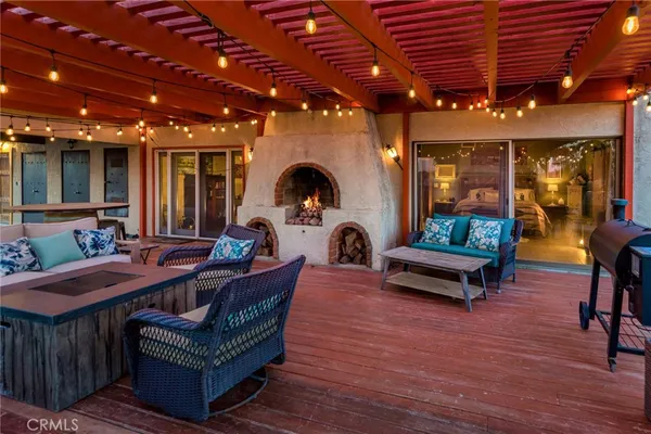 a kitchen with granite countertop a refrigerator and a sink
