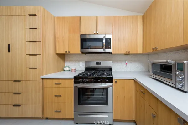 a view of a balcony with a table and chairs