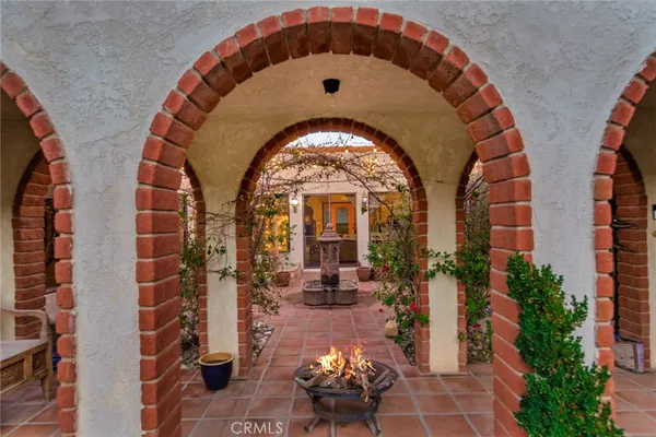 a living room with furniture fireplace and flat screen tv