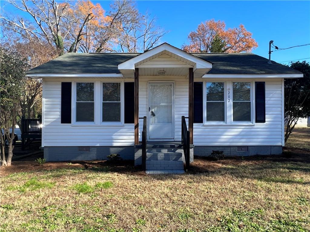 2021 Maple Avenue Southwest Rome, GA 30161 - Photo 1 of 1 a view of a house with wooden fence