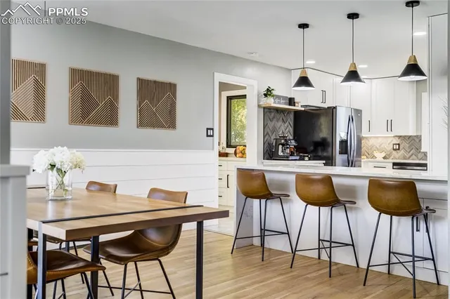 a dining room with furniture and window