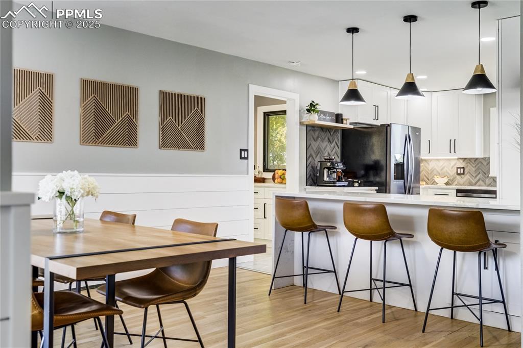 204 Mitchell Avenue Monument, CO 80132 - Photo 13 of 46 a dining room with furniture and window
