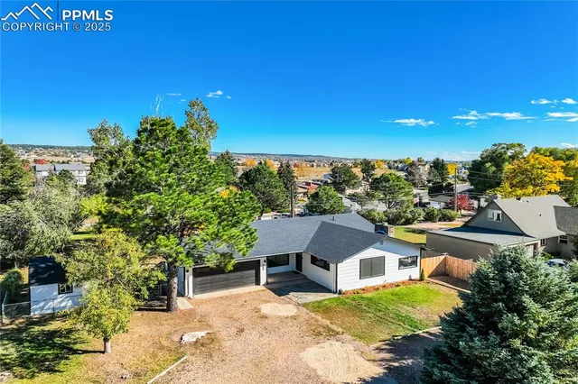 a view of a house with a big yard