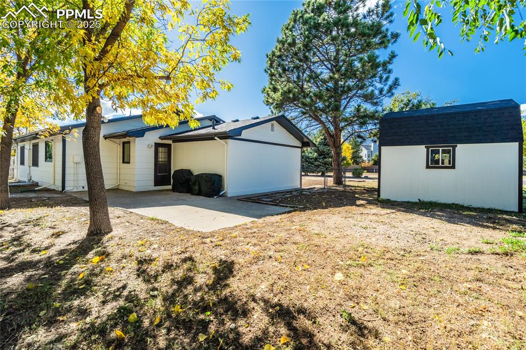 204 Mitchell Avenue Monument, CO 80132 - Photo 35 of 46 a front view of a house with a yard covered in snow