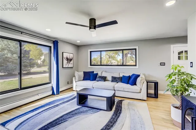 a living room with furniture and a large window