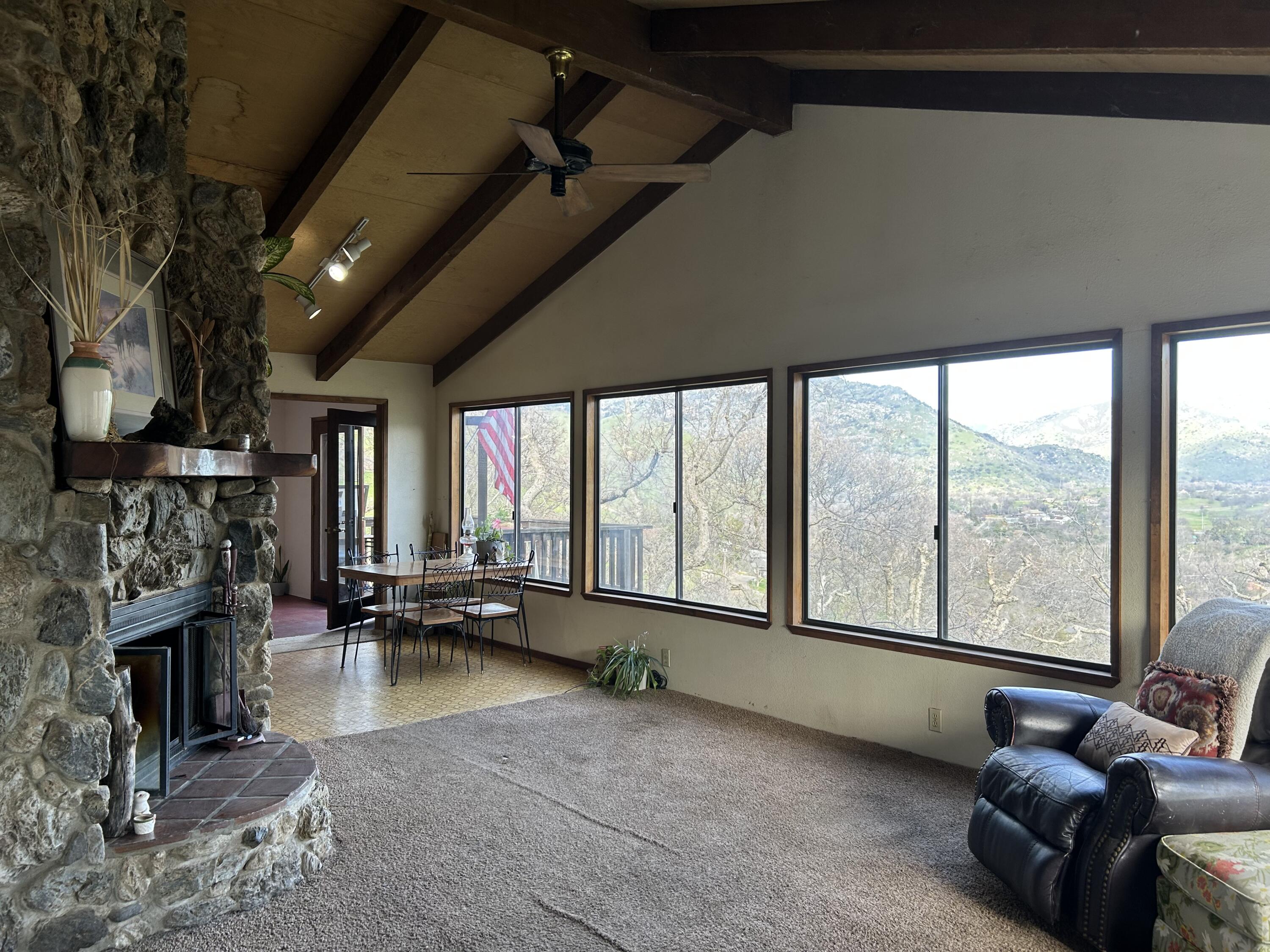 40838 Oak Ridge Drive Three Rivers, CA 93271 - Photo 16 of 51 a living room with fireplace furniture and a floor to ceiling window