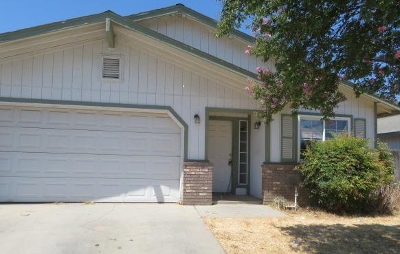 113 West Clark Street Madera, CA 93638 - Photo 2 of 11 a view of house with backyard