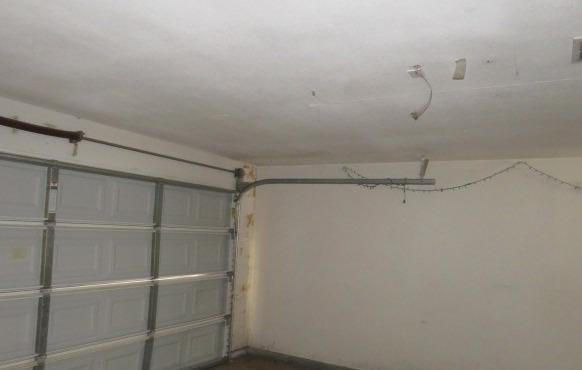 113 West Clark Street Madera, CA 93638 - Photo 9 of 11 a view of a room with racks on the wall