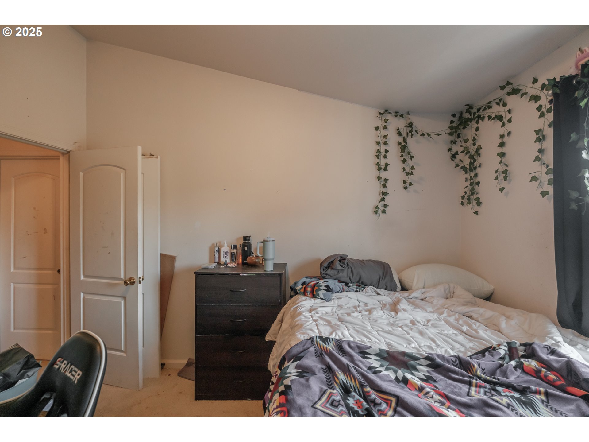 1036 9th Street Florence, OR 97439 - Photo 26 of 47 a bedroom with a bed and a dresser