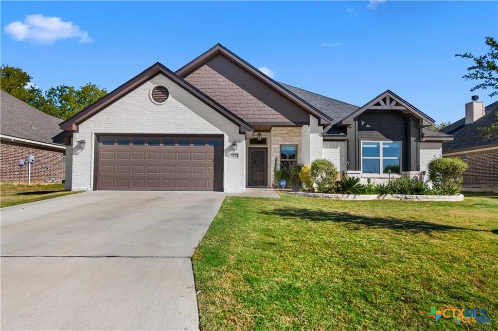 7306 Golden Heart Drive Temple, TX 76502 - Photo 1 of 25 a front view of a house with garden