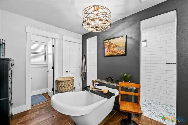 a bathroom with a sink a mirror and a window