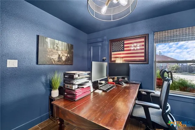 a workspace with furniture and window