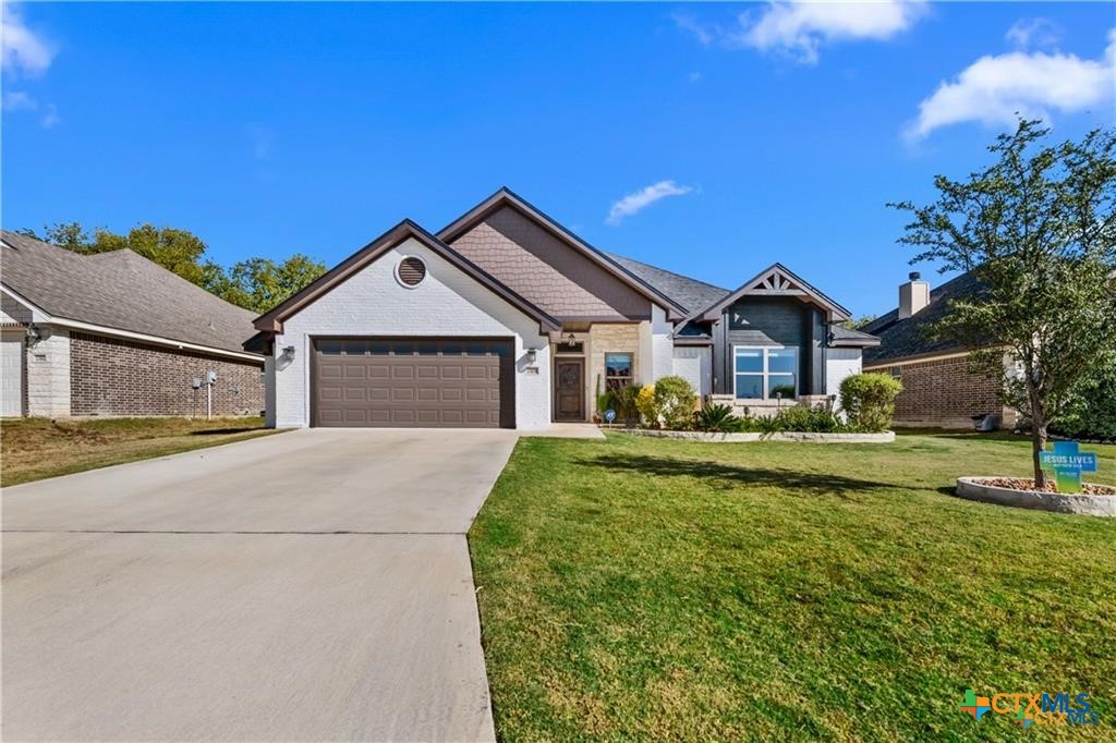 7306 Golden Heart Drive Temple, TX 76502 - Photo 2 of 25 a front view of a house with a yard and garage