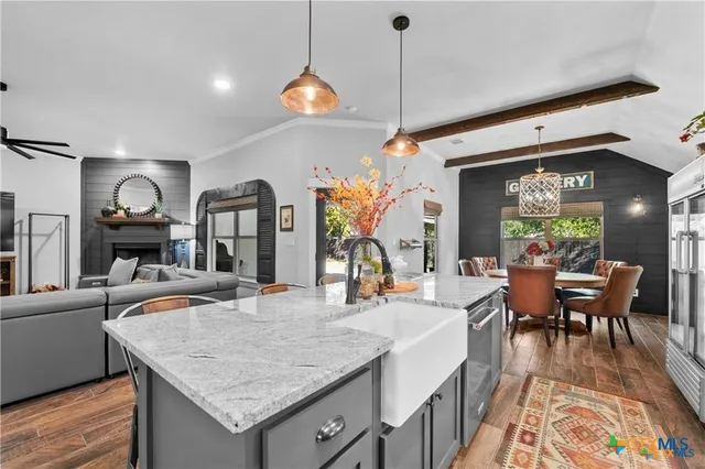 a dining table chairs and a fireplace