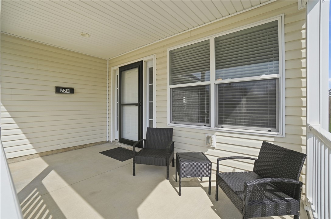 728 East Northern Avenue Springfield, OH 45503 - Photo 4 of 35 Enjoy quiet mornings or peaceful evenings on this welcoming covered porch.