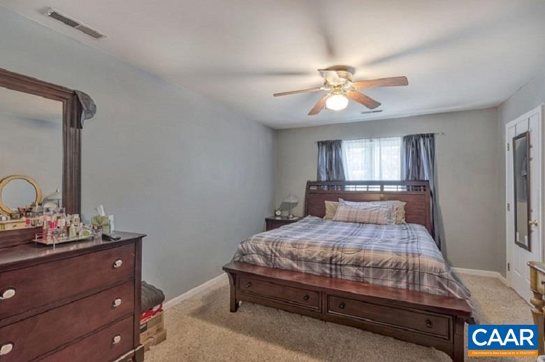 5 Cliftwood Road Palmyra, VA 22963 - Photo 17 of 49 a bedroom with a bed and ceiling fan