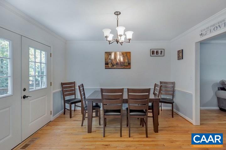 5 Cliftwood Road Palmyra, VA 22963 - Photo 10 of 49 a view of a dining room with furniture a chandelier and wooden floor