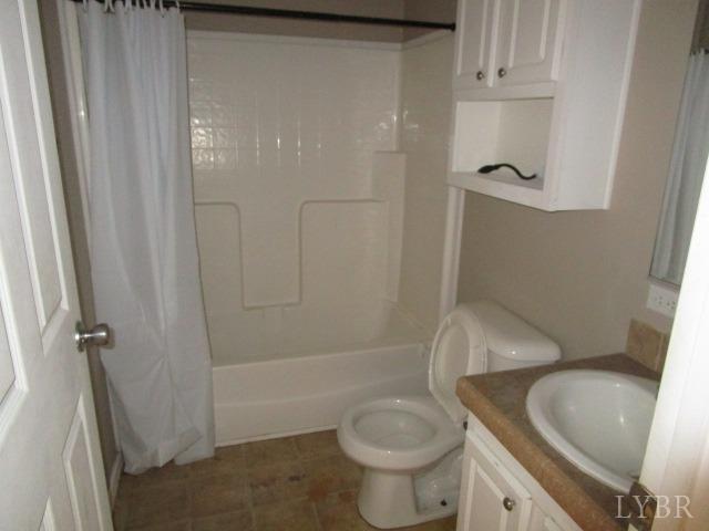 263 George Hairston Road Fieldale, VA 24089 - Photo 16 of 22 a bathroom with a granite countertop sink toilet and shower