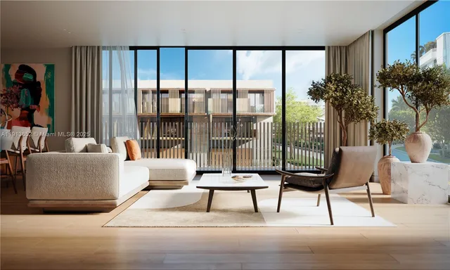 a living room with furniture and a large window with balcony view