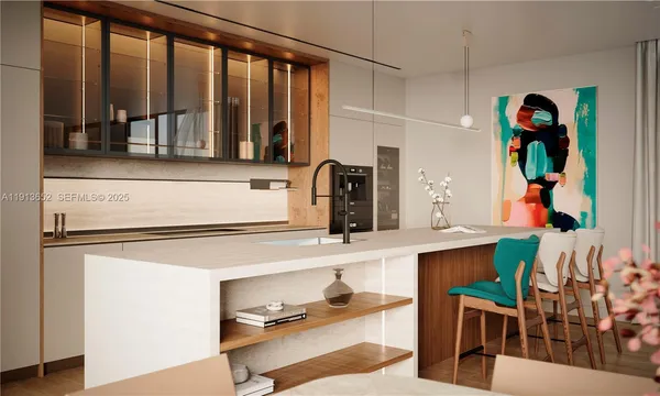 a kitchen with stainless steel appliances granite countertop a refrigerator and a counter space