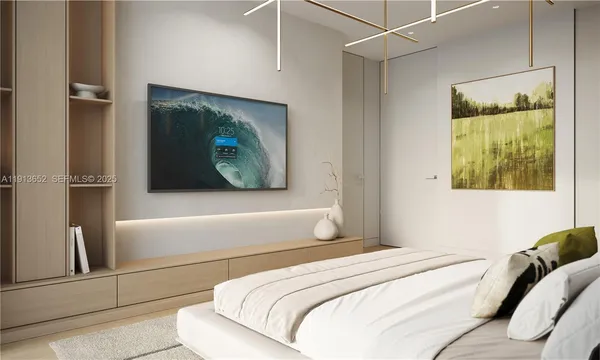 a bedroom with a bed and a painting on the wall