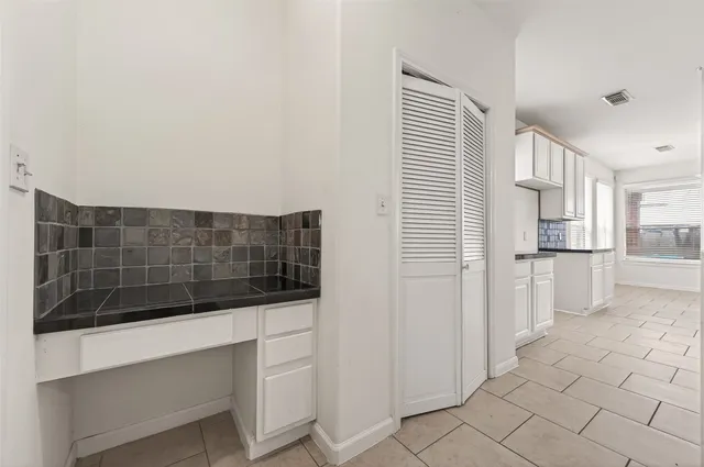 a view of a dining room with furniture wooden floor and chandelier