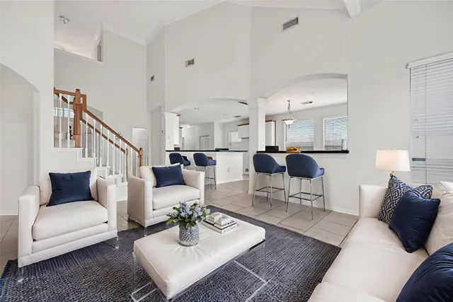 a living room with furniture or couch and a view of kitchen