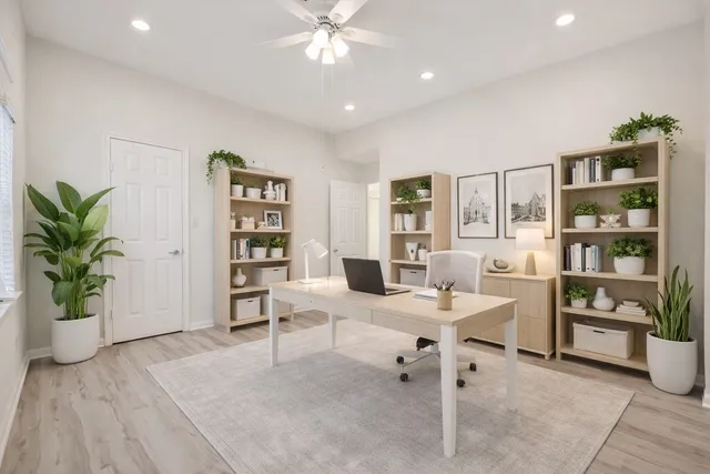 a view of a livingroom with an empty space and a fireplace