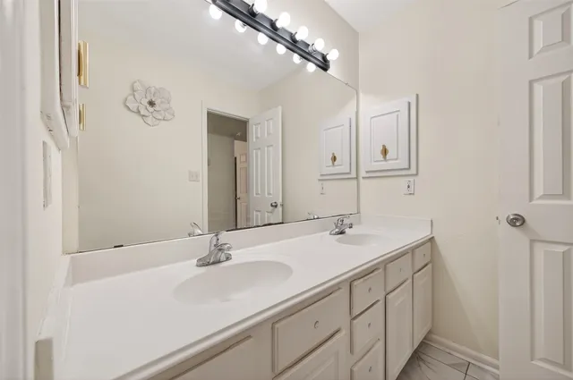 an aerial view of residential houses with outdoor space and parking