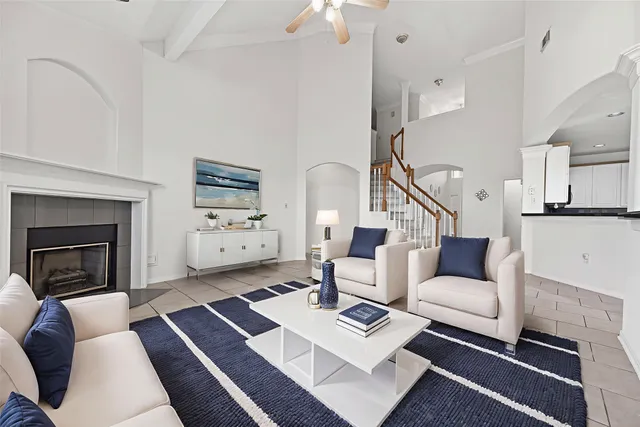 a large kitchen with stainless steel appliances granite countertop a stove top oven a sink a counter space and cabinets