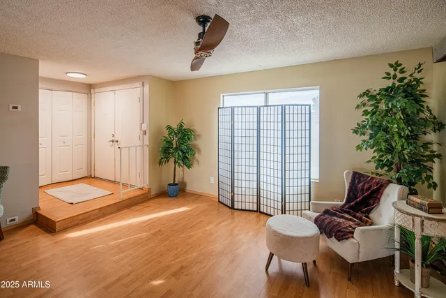 a livingroom with furniture and a window