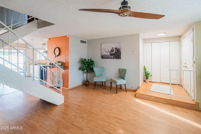 a view of an entryway with wooden floor