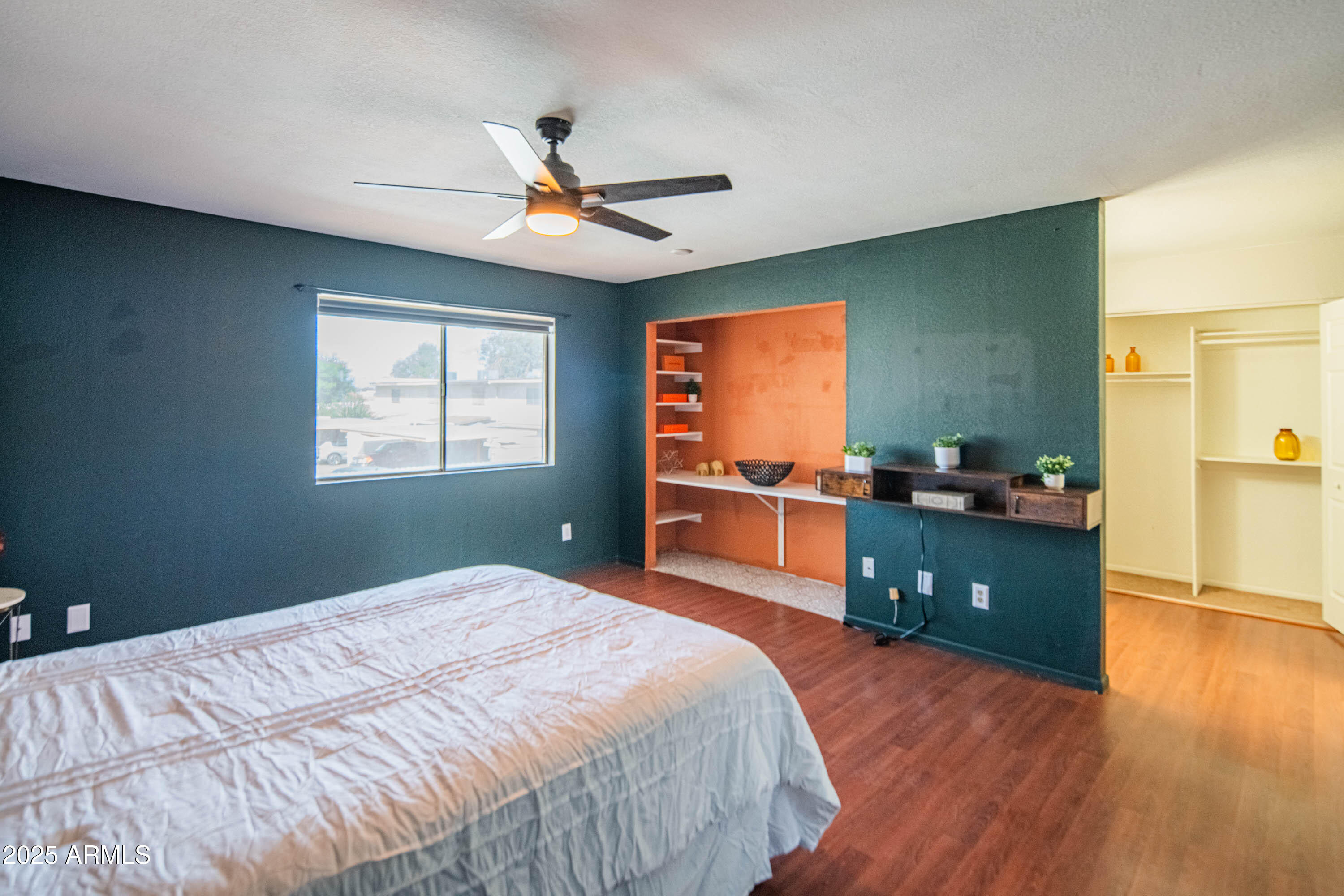 3203 West Royal Palm Road Phoenix, AZ 85051 - Photo 15 of 29 a bedroom with a bed and a dresser