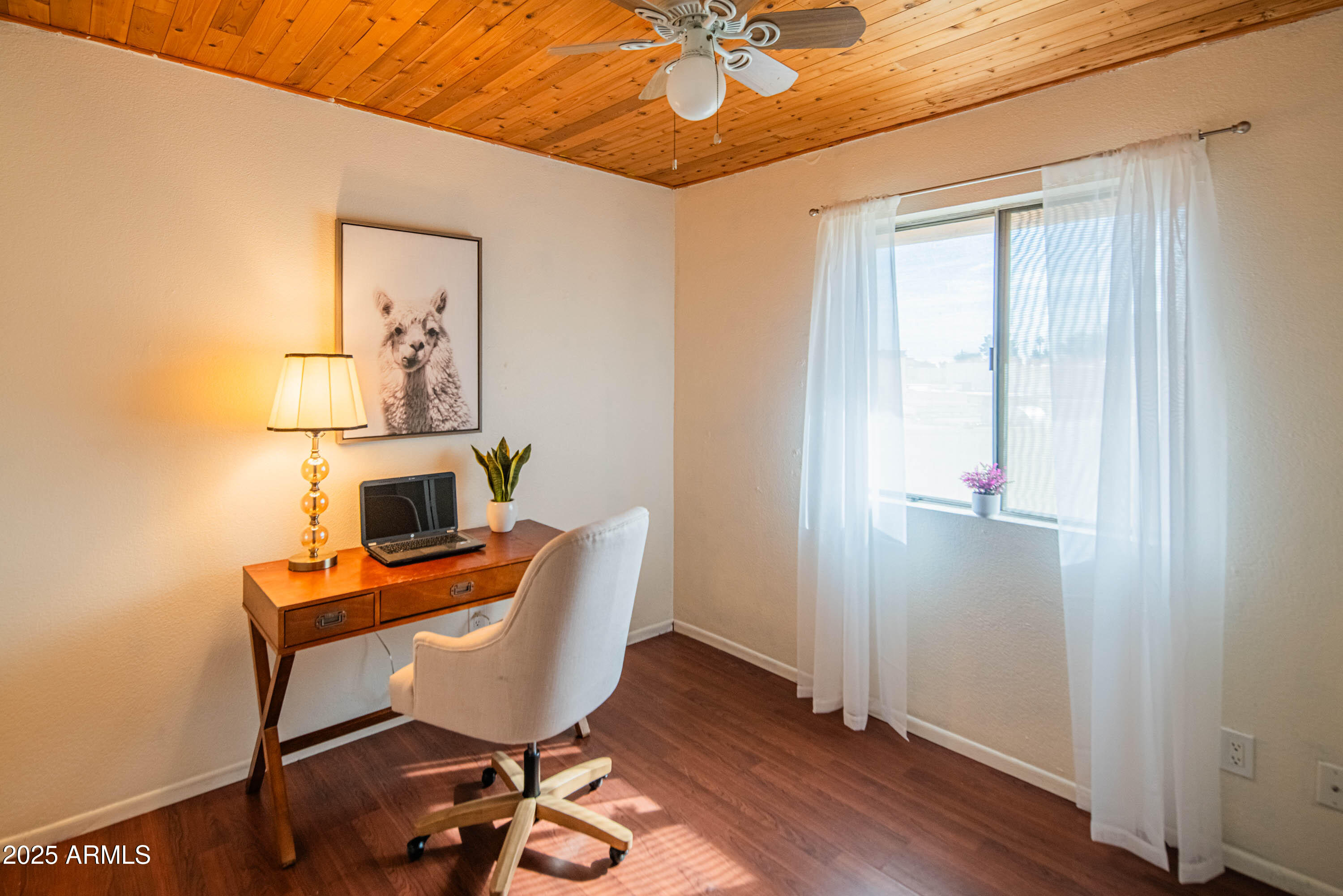 3203 West Royal Palm Road Phoenix, AZ 85051 - Photo 23 of 29 a workspace with furniture and wooden floor