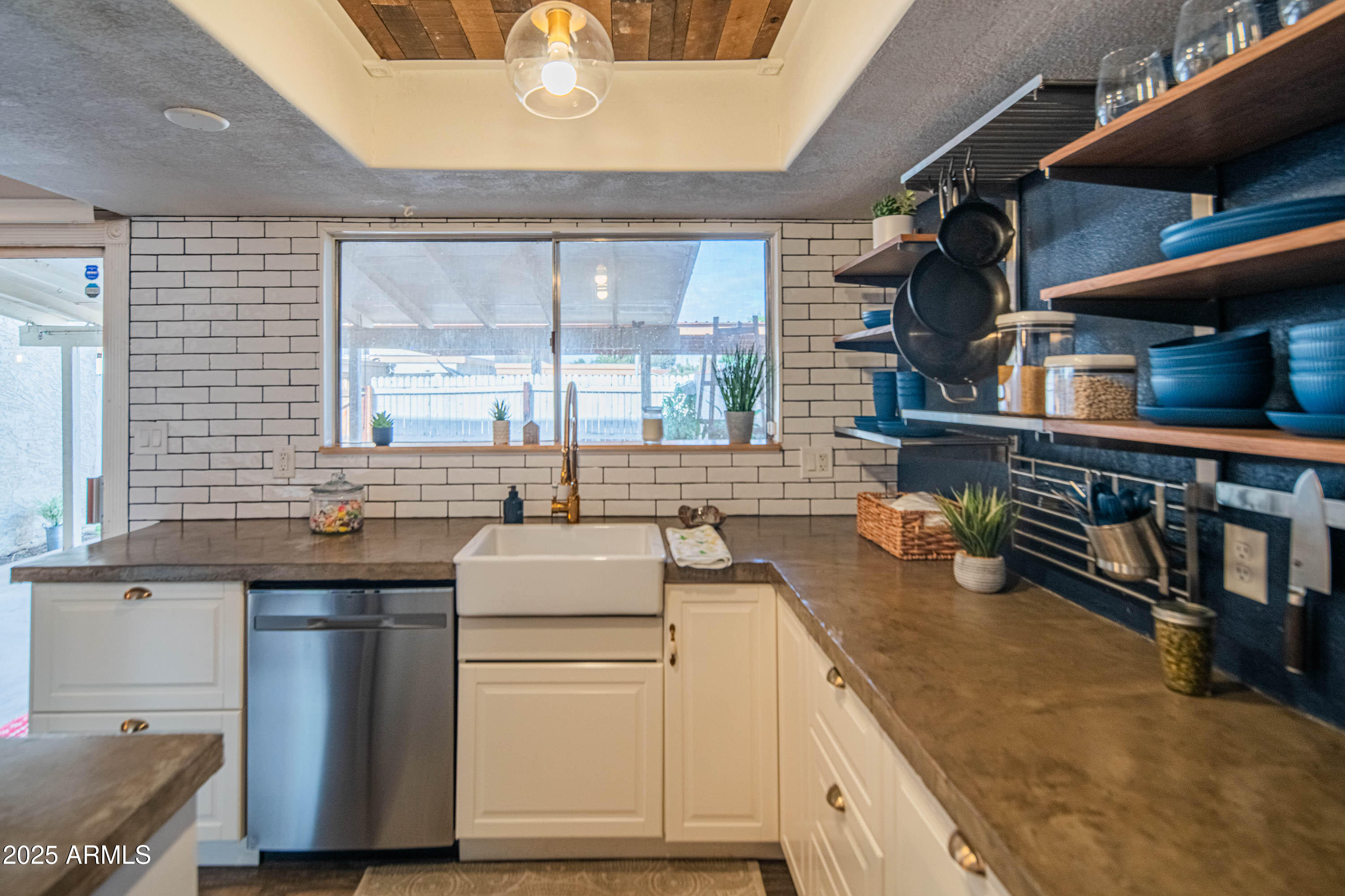 3203 West Royal Palm Road Phoenix, AZ 85051 - Photo 4 of 29 a kitchen with sink cabinets and appliances