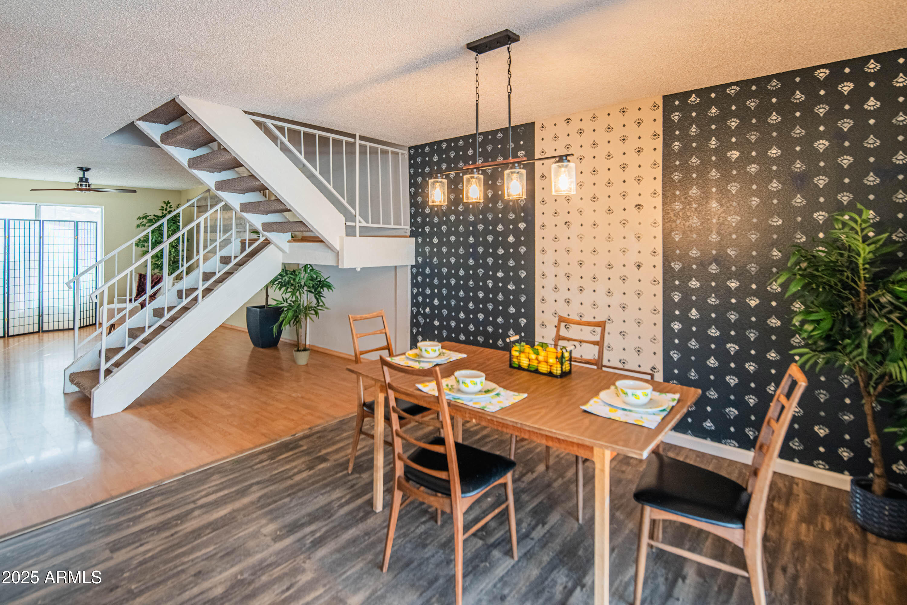 3203 West Royal Palm Road Phoenix, AZ 85051 - Photo 8 of 29 a view of a dining room with furniture window and wooden floor