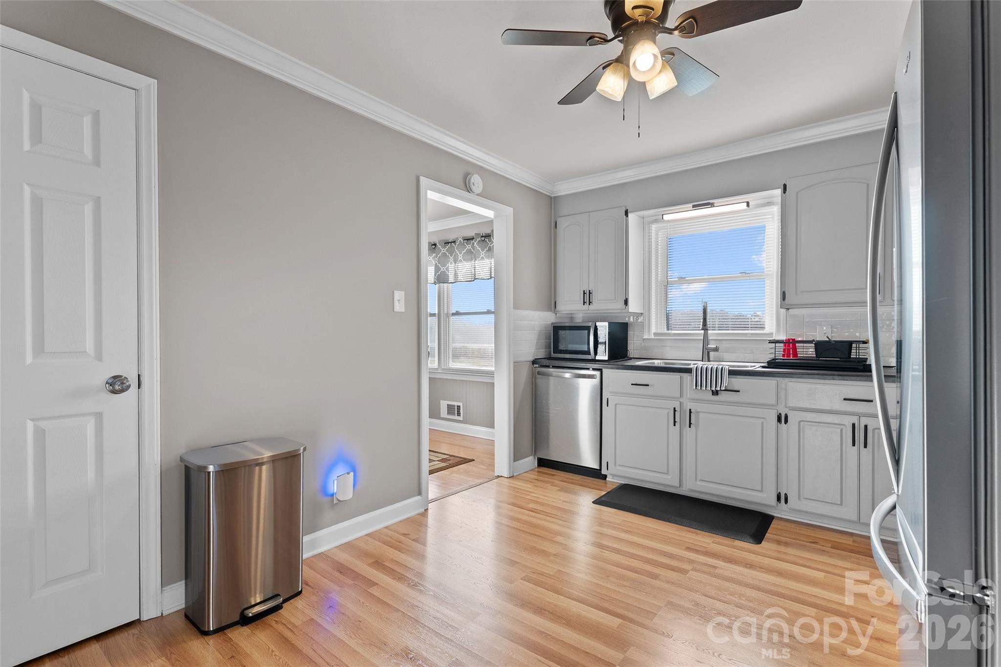 871 Saluda Road Chester, SC 29706 - Photo 17 of 46 a kitchen with stainless steel appliances a sink cabinets and wooden floor