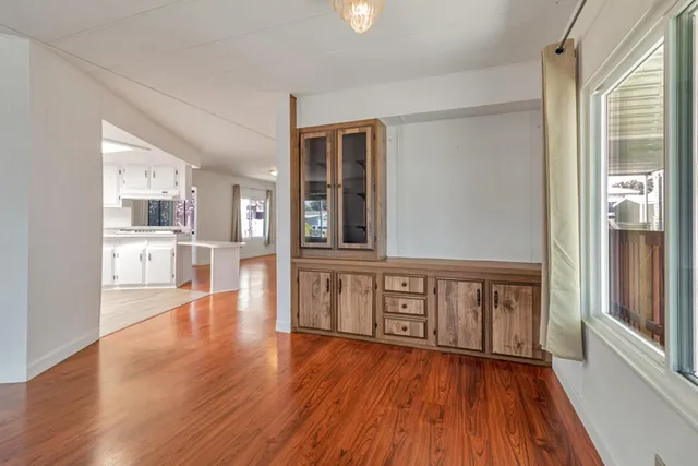 a view of an entryway with wooden floor