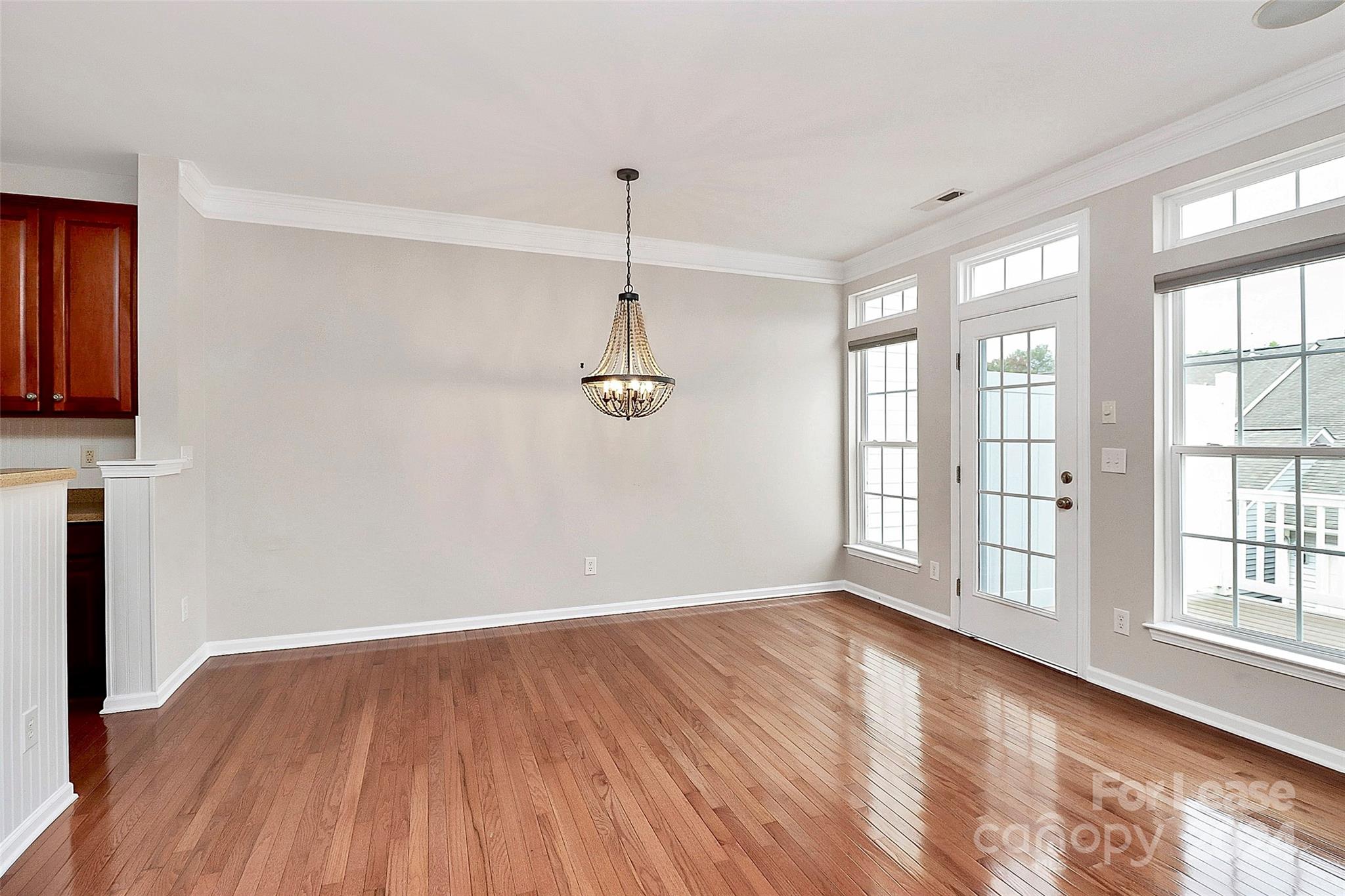 20543 Harbor View Drive Cornelius, NC 28031 - Photo 11 of 35 a view of an empty room with a window and wooden floor