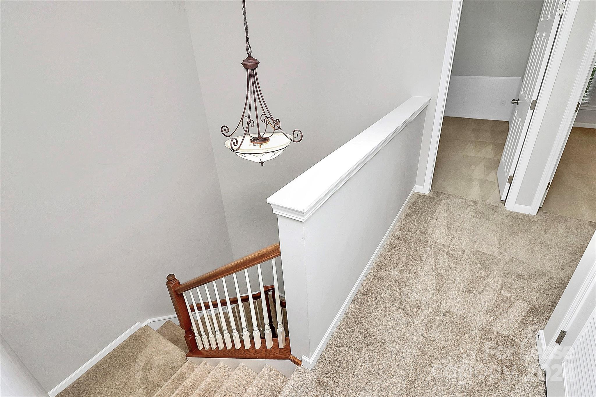 20543 Harbor View Drive Cornelius, NC 28031 - Photo 20 of 35 a view of staircase with railing and white walls