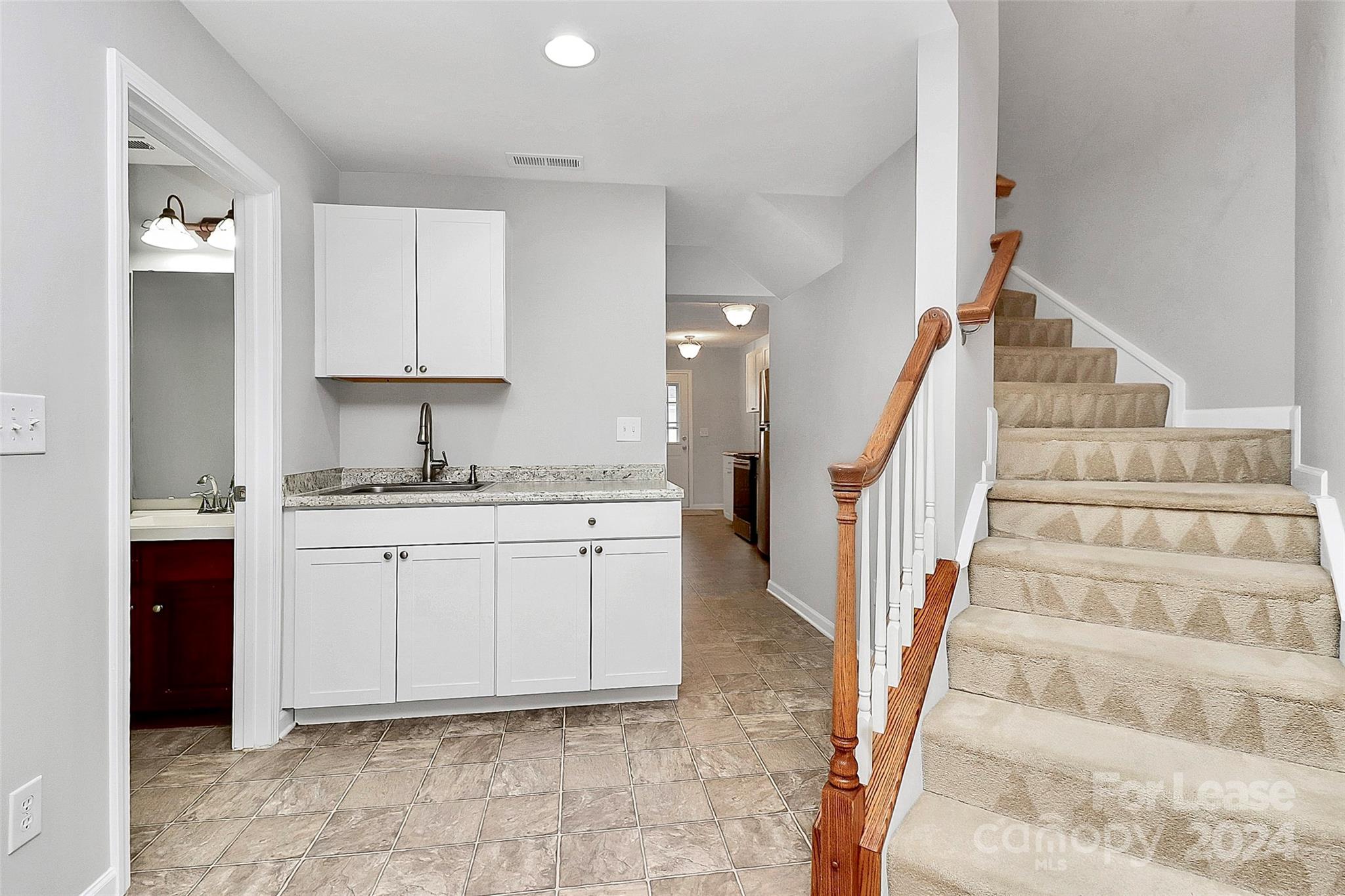 20543 Harbor View Drive Cornelius, NC 28031 - Photo 21 of 35 a kitchen with white cabinets and sink