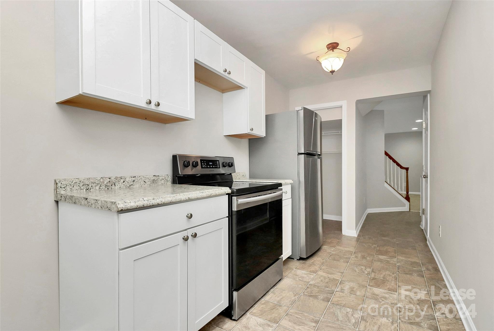 20543 Harbor View Drive Cornelius, NC 28031 - Photo 22 of 35 a kitchen with stainless steel appliances granite countertop a refrigerator and a stove top oven