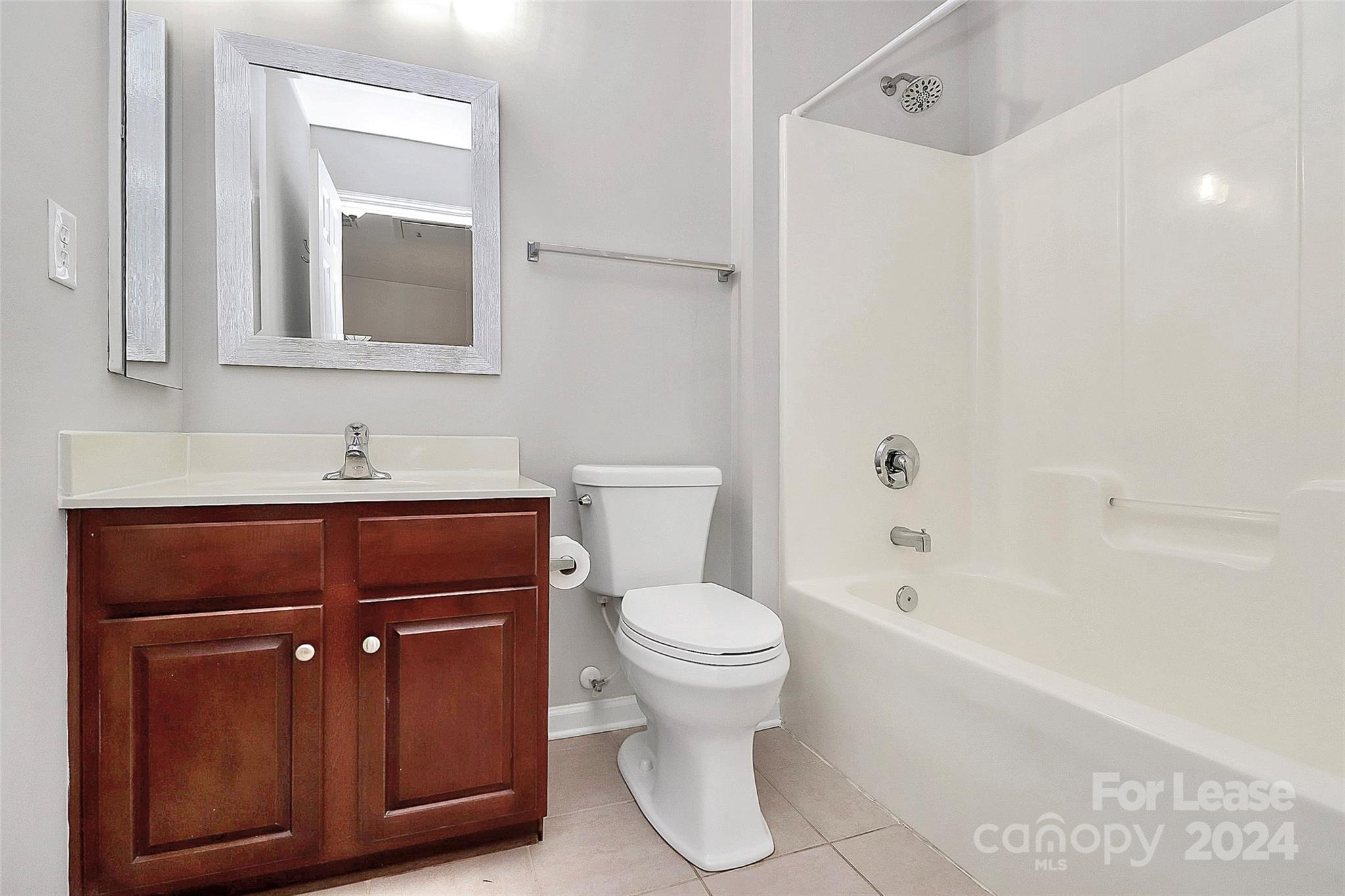20543 Harbor View Drive Cornelius, NC 28031 - Photo 24 of 35 a bathroom with a toilet sink and mirror