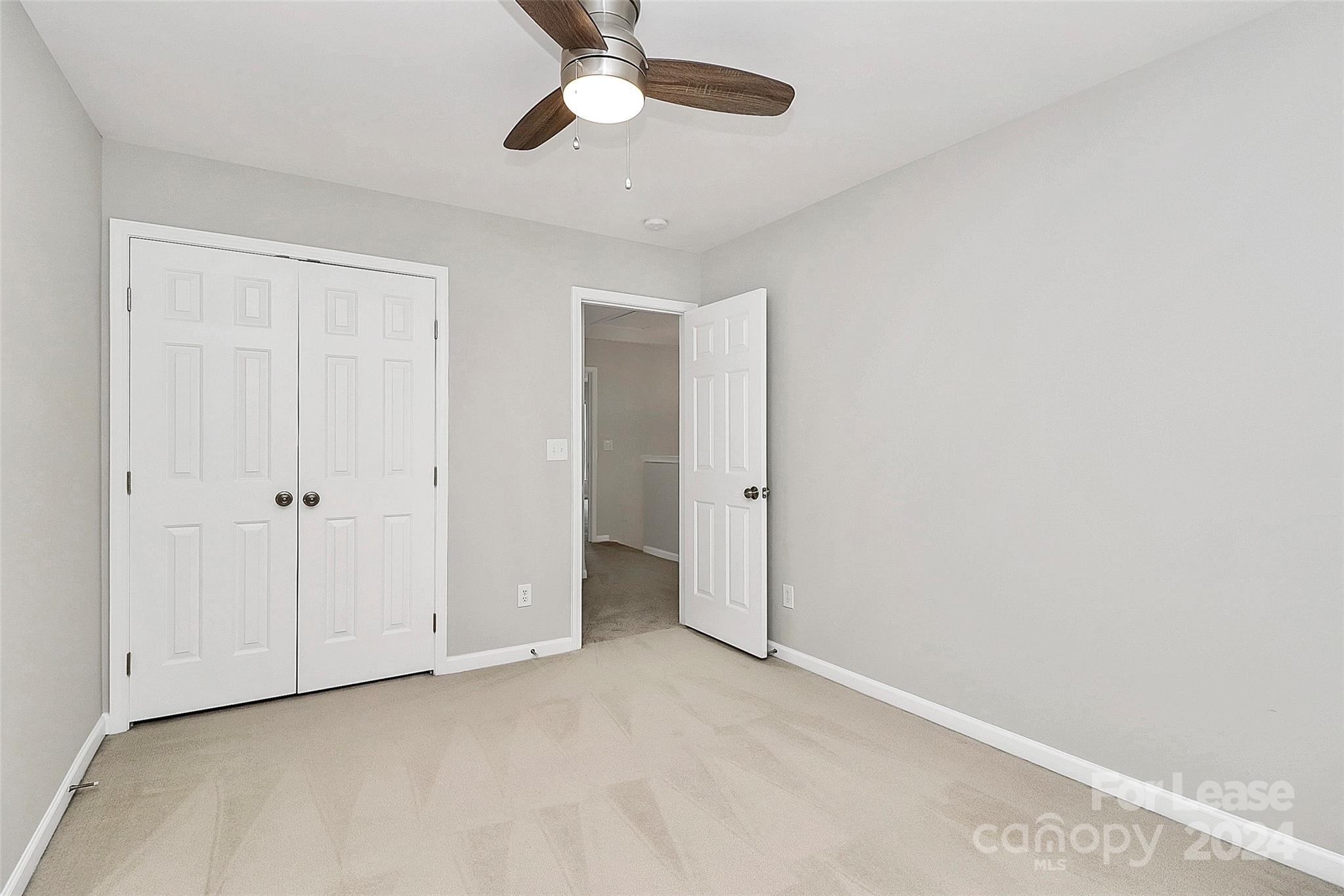 20543 Harbor View Drive Cornelius, NC 28031 - Photo 26 of 35 a view of an empty room and chandelier fan