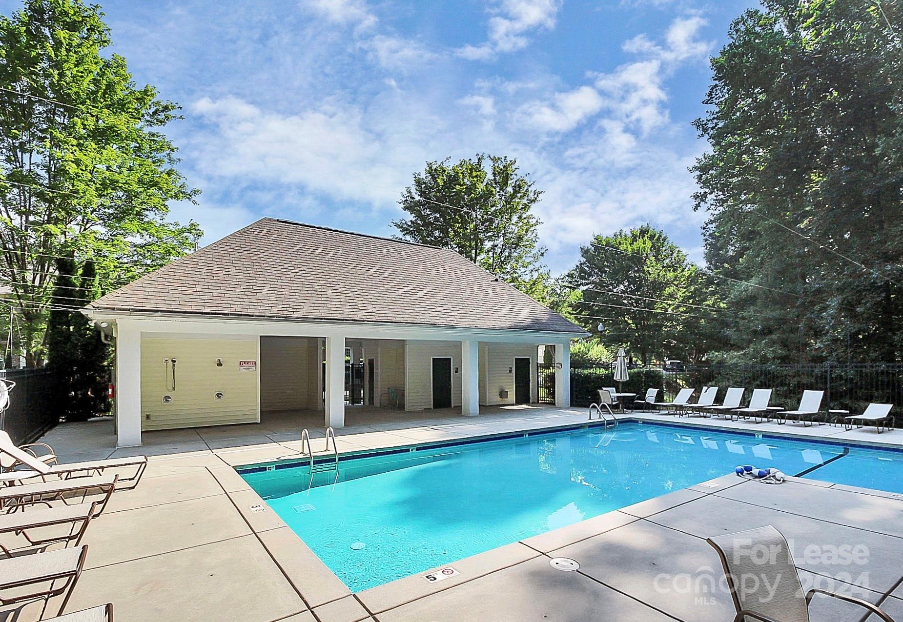 20543 Harbor View Drive Cornelius, NC 28031 - Photo 34 of 35 a view of a white house with a swimming pool and sitting area