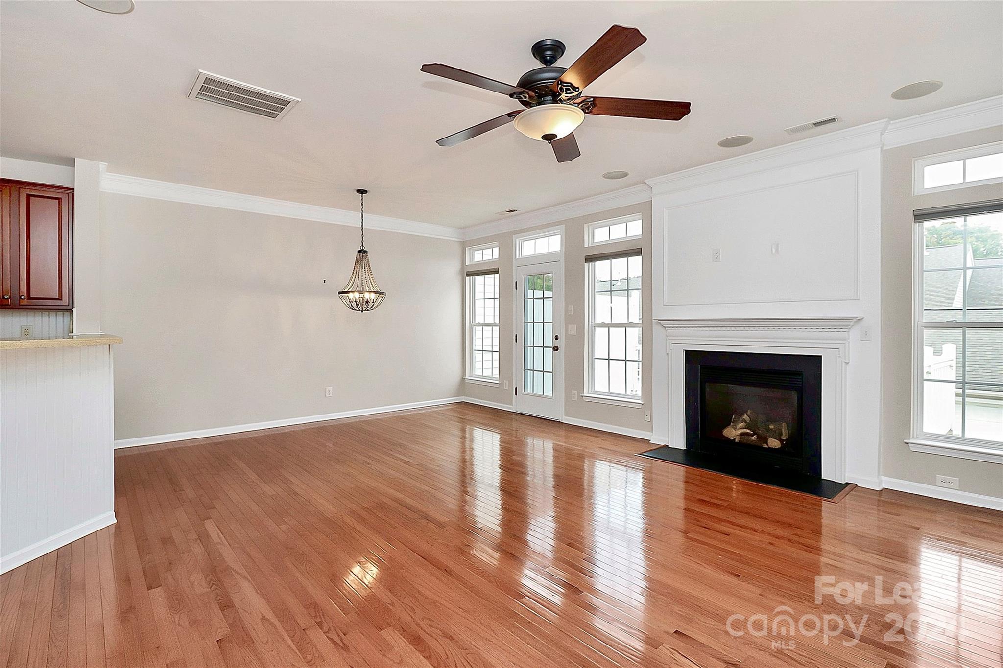 20543 Harbor View Drive Cornelius, NC 28031 - Photo 8 of 35 a view of an empty room with wooden floor fireplace and a window