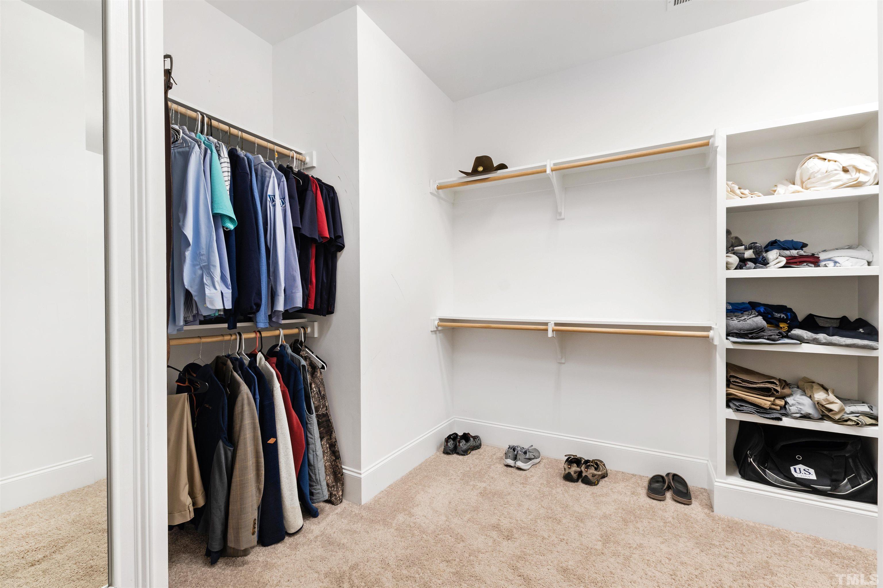 4121 Olde Judd Drive Willow Spring, NC 27592 - Photo 33 of 61 a view of walk in closet with clothes and shoes